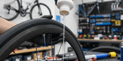 Close-up of tubeless tire conversion with sealant