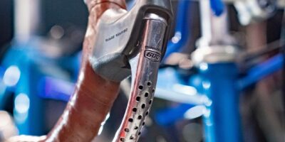 cyclist adjusting bike saddle height hex wrench