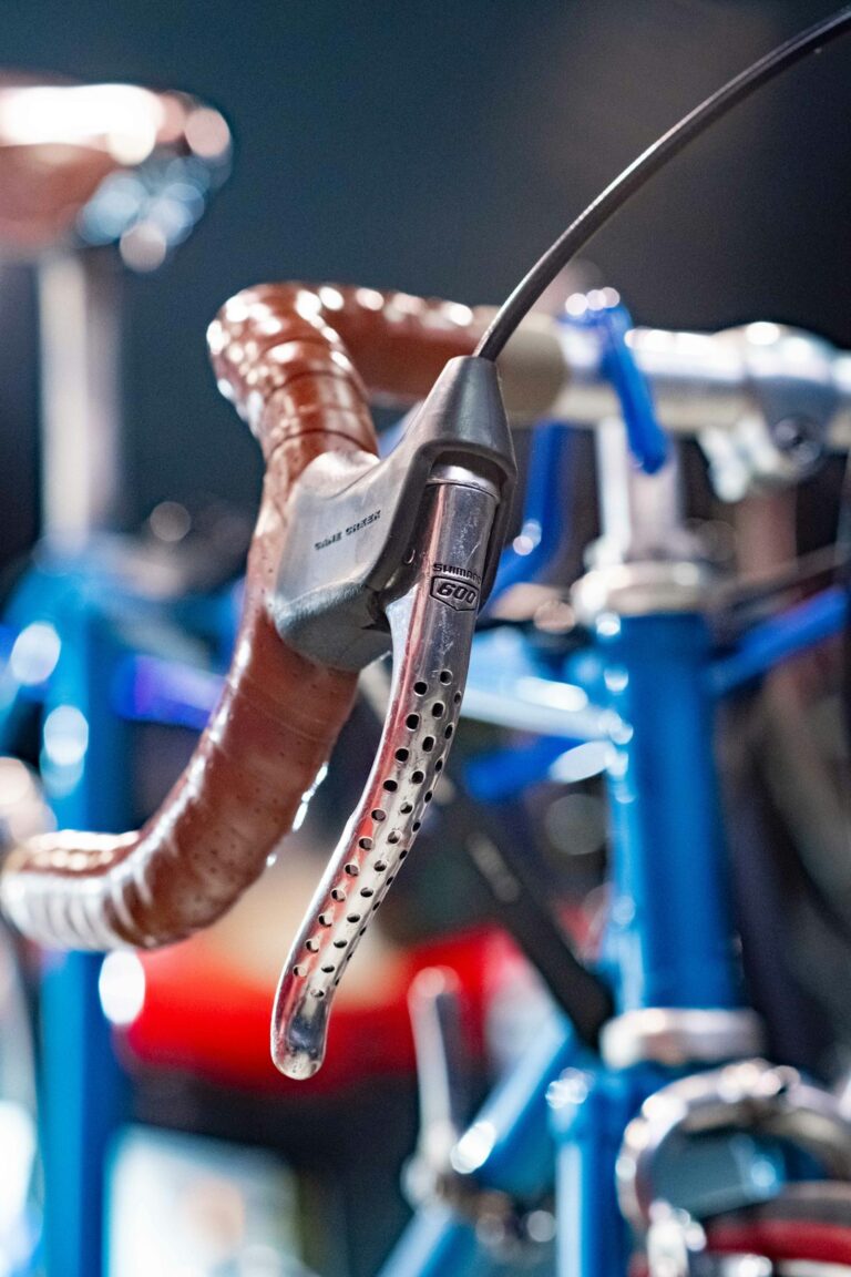 cyclist adjusting bike saddle height hex wrench